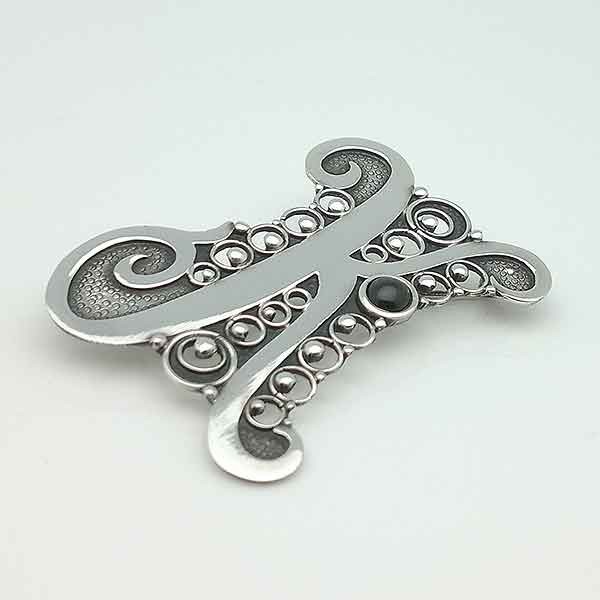 Initial brooch, letter K. Made in sterling silver.