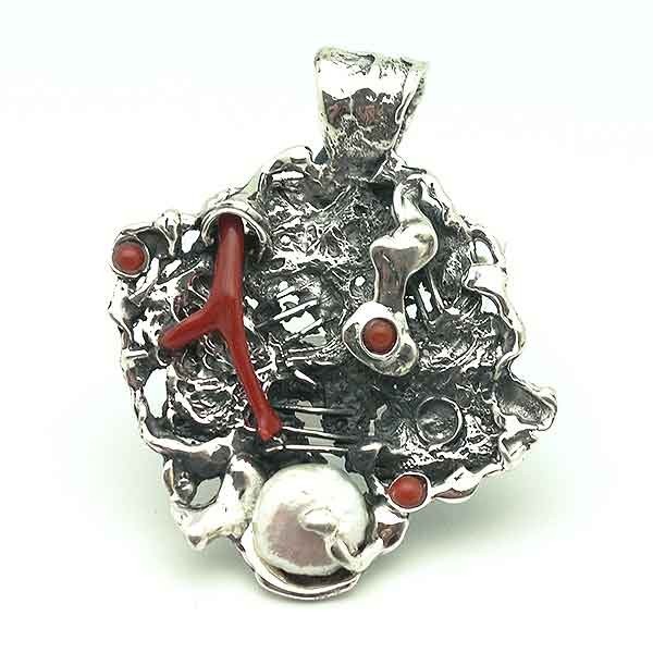 Silver and coral pendant