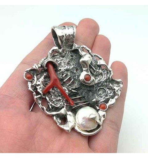 Silver and coral pendant