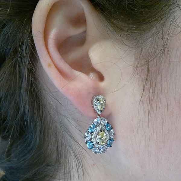 Earrings with colored zircons