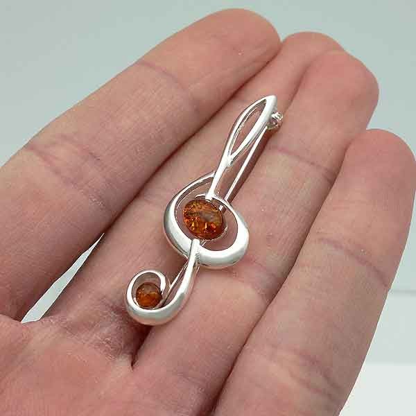 Broche ambar clave de sol