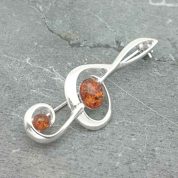 Broche ambar clave de sol
