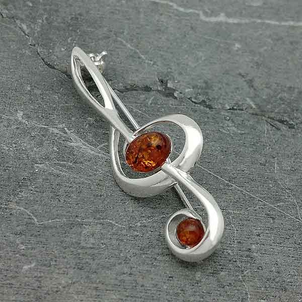 Broche ambar clave de sol