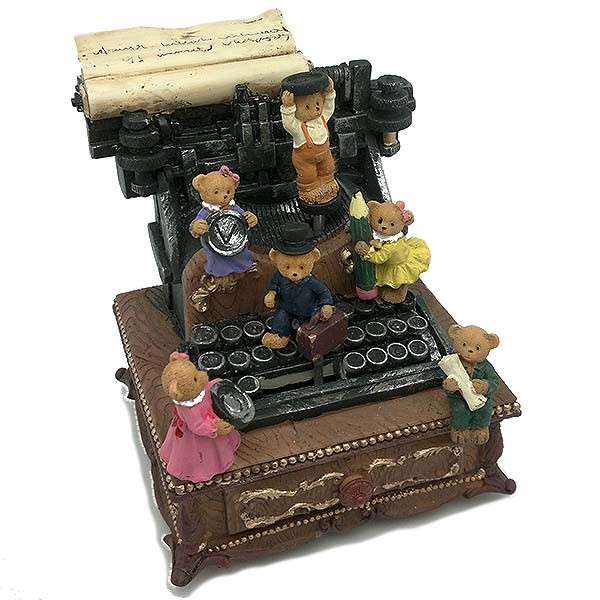 Caja de música con forma de máquina de escribir.