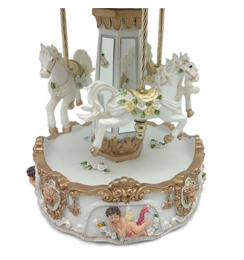 Musical carousel, in white and gold tones