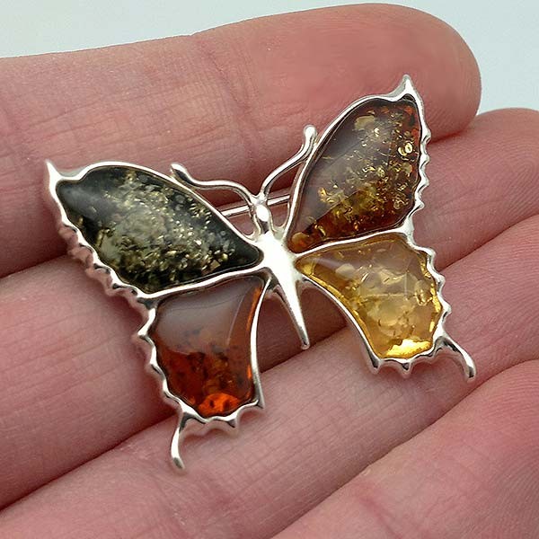 Butterfly brooch, in silver and amber