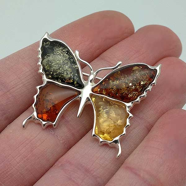 Butterfly brooch, in silver and amber