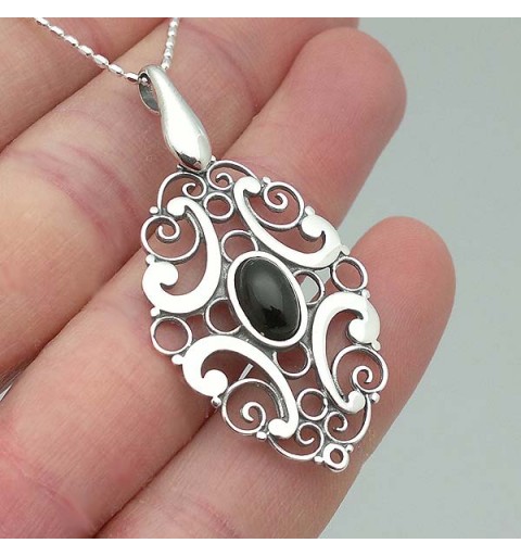 Pendant, silver and jet.