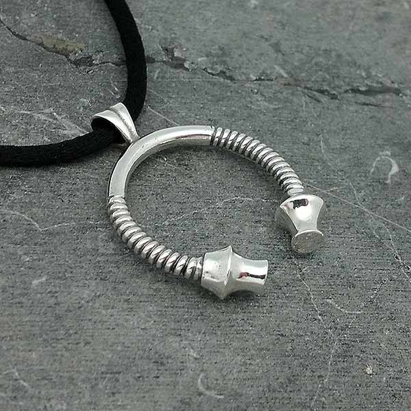 Torque pendant in sterling silver.