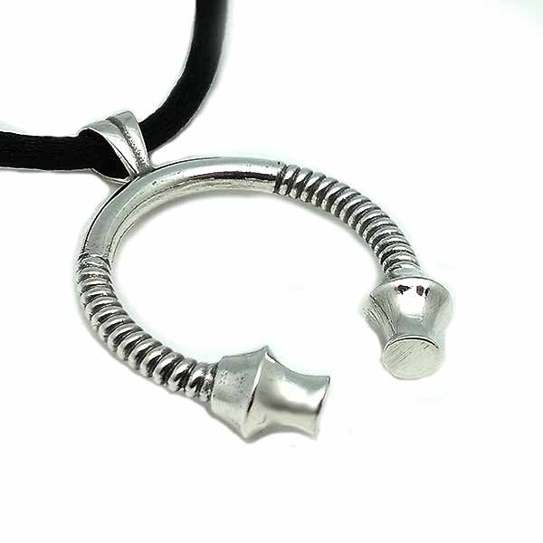 Torque pendant in sterling silver.