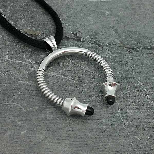 Unisex pendant, shaped like a torque.