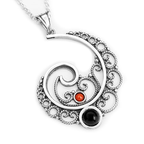 Circular pendant, in silver, jet and coral.