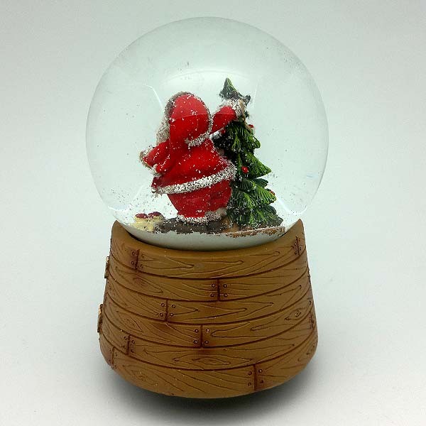 Musical snow globe, with Santa Claus and Christmas tree.