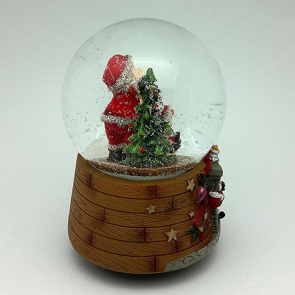 Bola de nieve musical, con papá Noel y árbol navideño.
