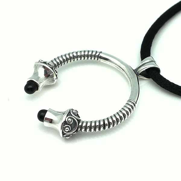 Torque-shaped pendant in sterling silver and jet.