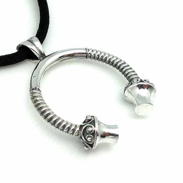 Men's pendant, shaped like a torque, in silver.