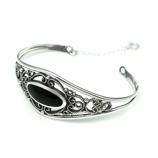 Bangle type bracelet, in silver and jet.