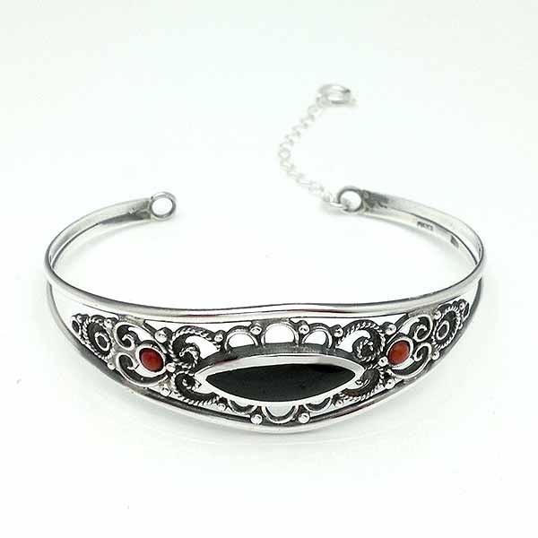 Rigid bracelet, in sterling silver, jet and coral.