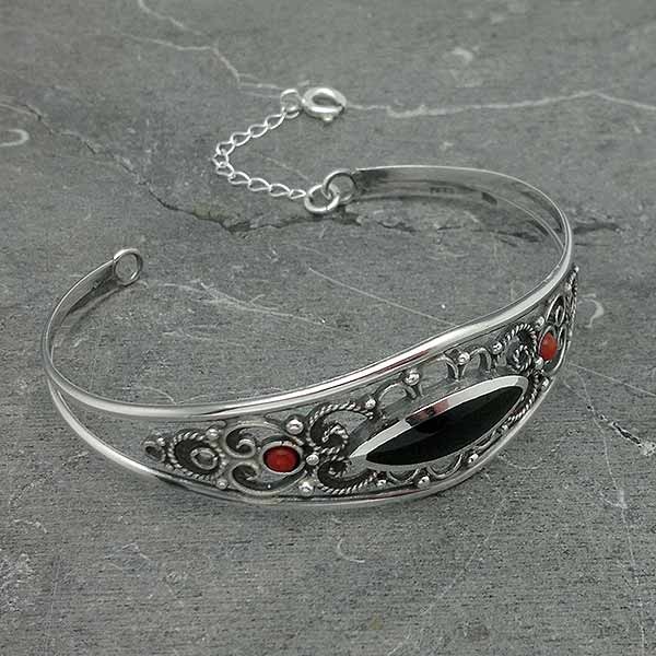 Rigid bracelet, in sterling silver, jet and coral.