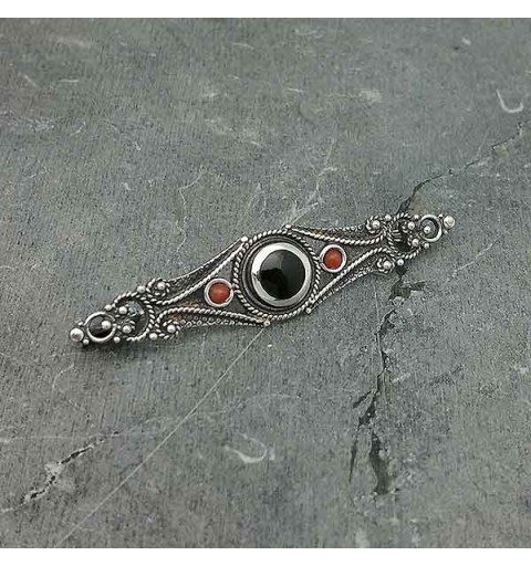 Classic style brooch, in sterling silver, jet and coral.