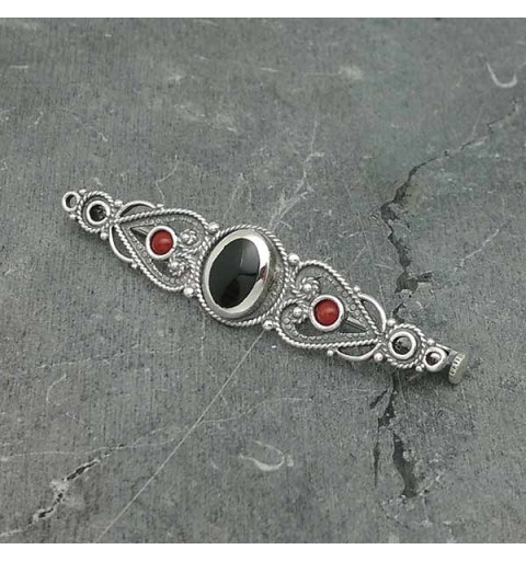 Elongated brooch, classic style, made of sterling silver, jet and coral.