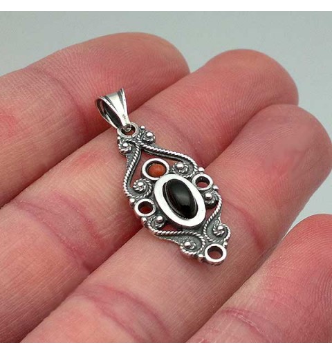 Classic pendant, made of sterling silver, jet and coral.