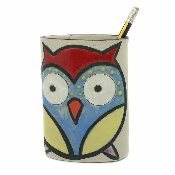 Ceramic owl-shaped pencil holder.