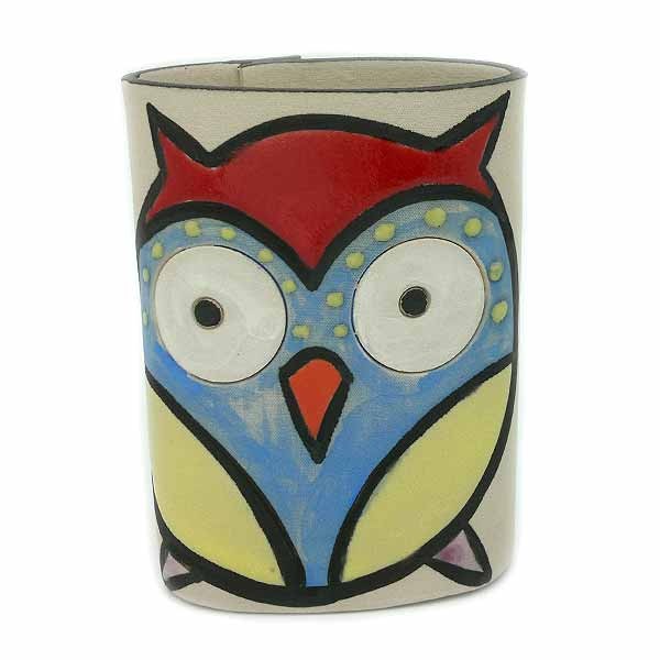 Ceramic owl-shaped pencil holder.