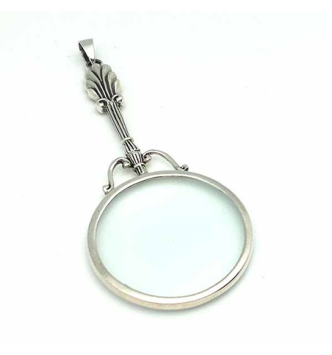 Pendant in sterling silver, shaped like a magnifying glass.