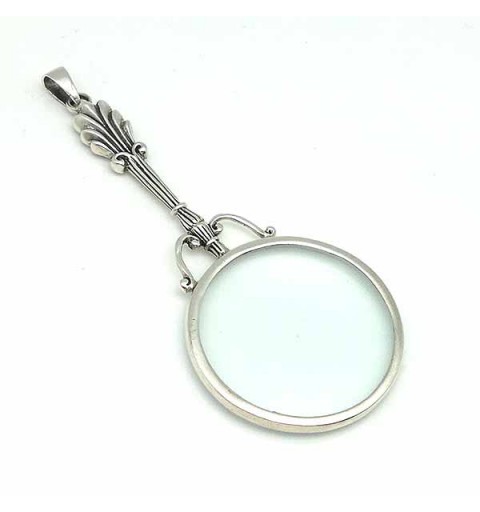 Pendant in sterling silver, shaped like a magnifying glass.