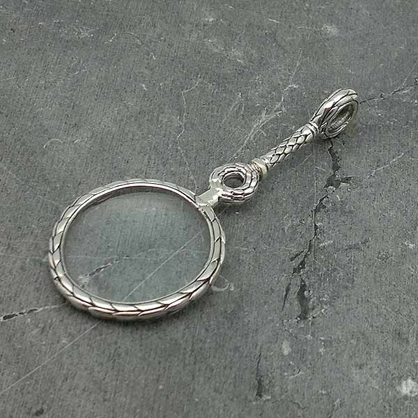 Pendant for ladies, in sterling silver, shaped like a magnifying glass.