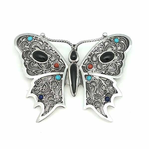 Brooch and pendant, in the shape of a butterfly, made by hand, in sterling silver and natural pieces.
