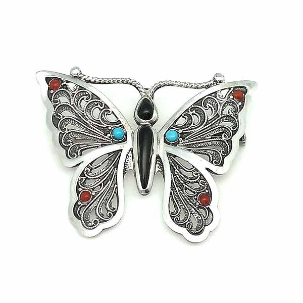 Brooch in the shape of a butterfly, handcrafted in sterling silver and natural stones.