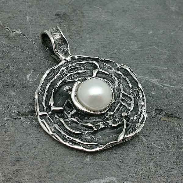 Baroque or contemporary style pendant, made of sterling silver and cultured pearl.