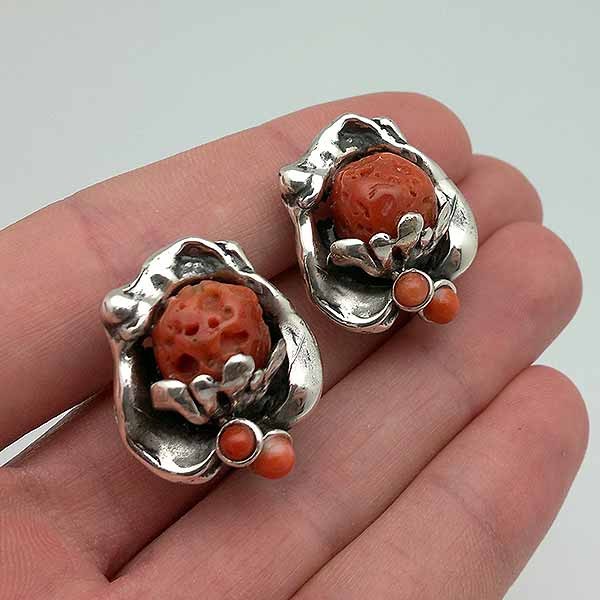 Sterling silver and coral earrings, with omega clasp.