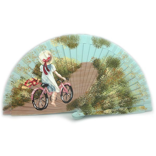 Hand-painted fan, in which we can see a girl taking a ride on a pink bicycle.