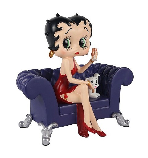 Betty Boop, sitting on the couch with her dog Pudgy.