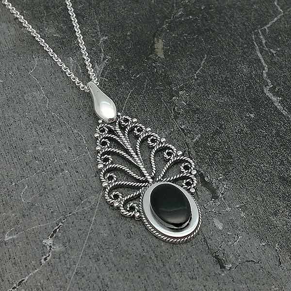 Pendant in sterling silver and jet, in the shape of a leaf.