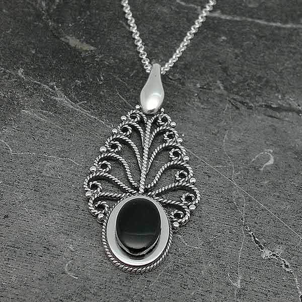 Pendant in sterling silver and jet, in the shape of a leaf.