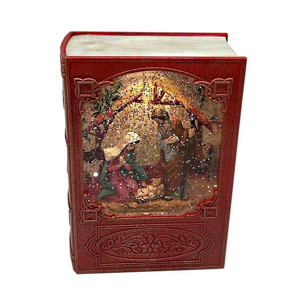 Caja de música navideña, con forma de libro, en la que vemos el nacimiento de Jesús.