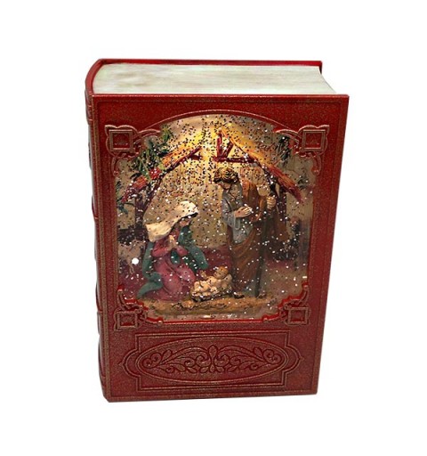 Caja de música navideña, con forma de libro, en la que vemos el nacimiento de Jesús.