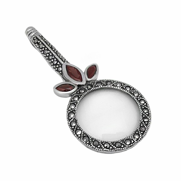Magnifying glass pendant with garnets