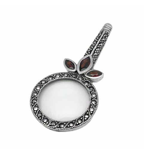 Magnifying glass pendant with garnets