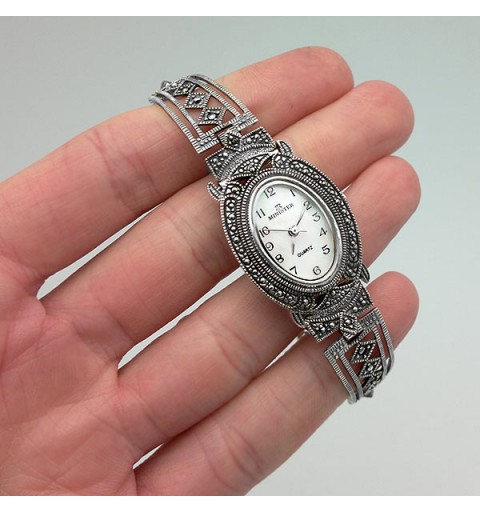 Aged silver watch with oval case