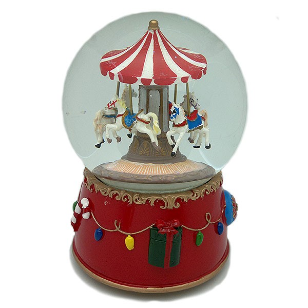 Snow globe, with a merry-go-round inside, wind-up operation.