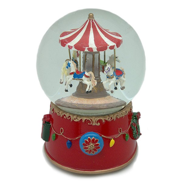 Snow globe, with a merry-go-round inside, wind-up operation.
