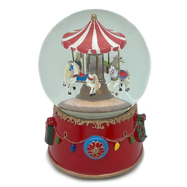 Snow globe, with a merry-go-round inside, wind-up operation.