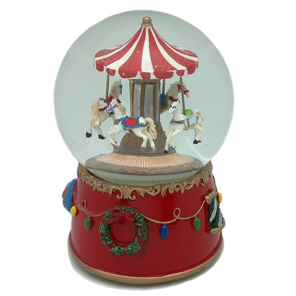 Snow globe, with a merry-go-round inside, wind-up operation.