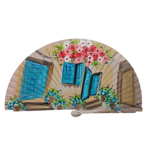 Handmade fan facade with flowers and blue windows