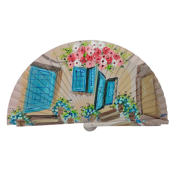 Handmade fan facade with flowers and blue windows